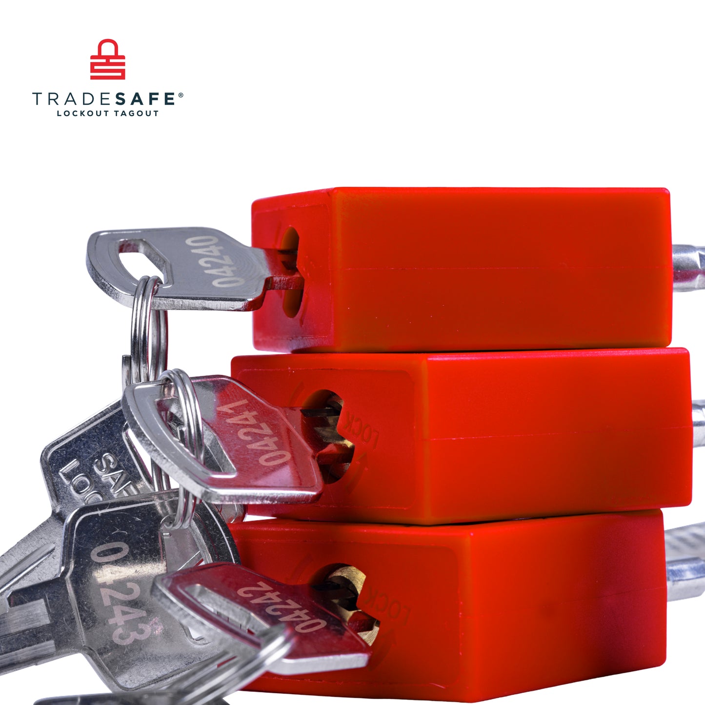 close up view of three red loto steel cable padlocks stacked together with keys inserted in each padlock