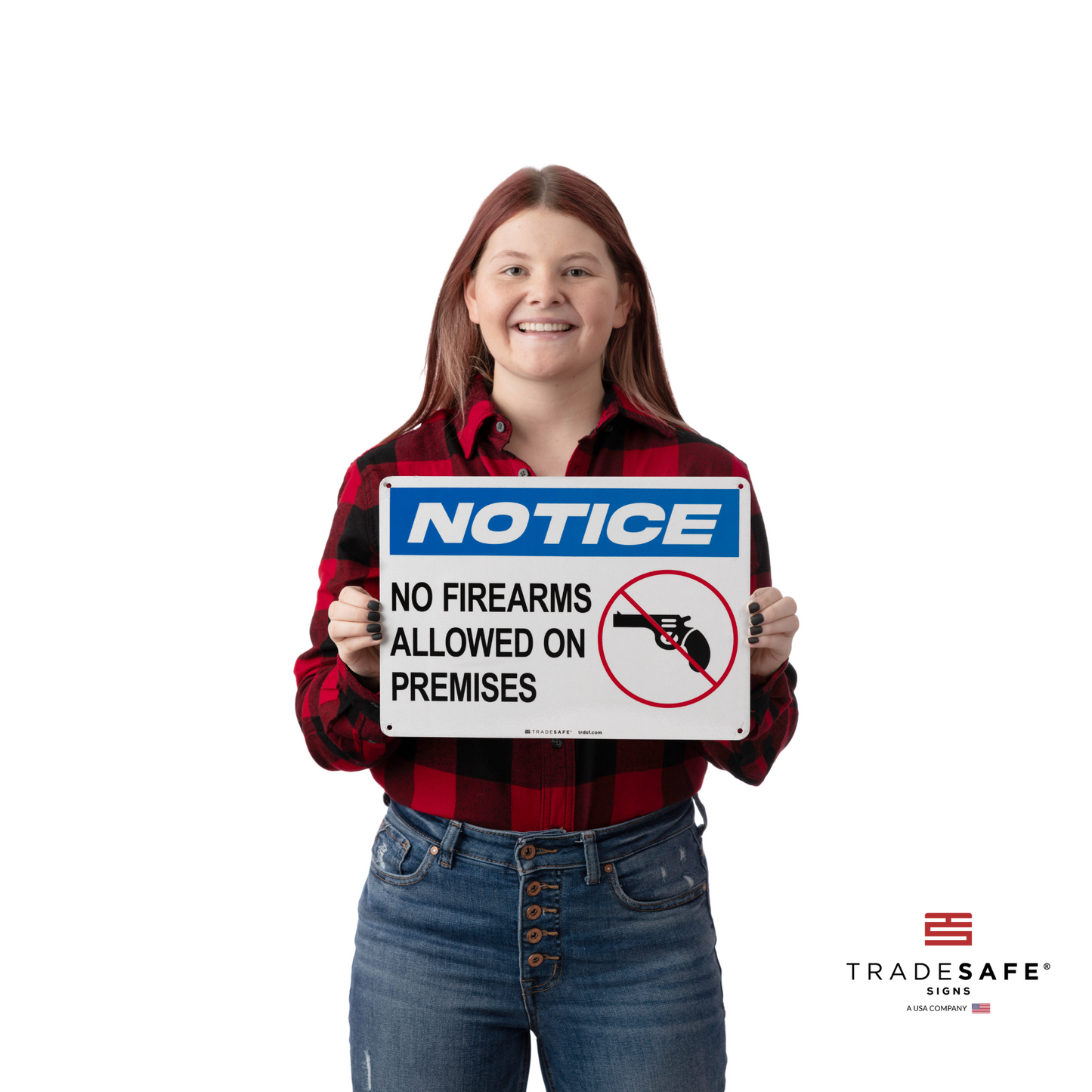 a person holding a notice sign with the text "no firearms allowed on premises"