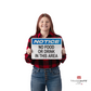 a person holding the notice sign