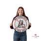 a person holding "no forklifts in this area" sign