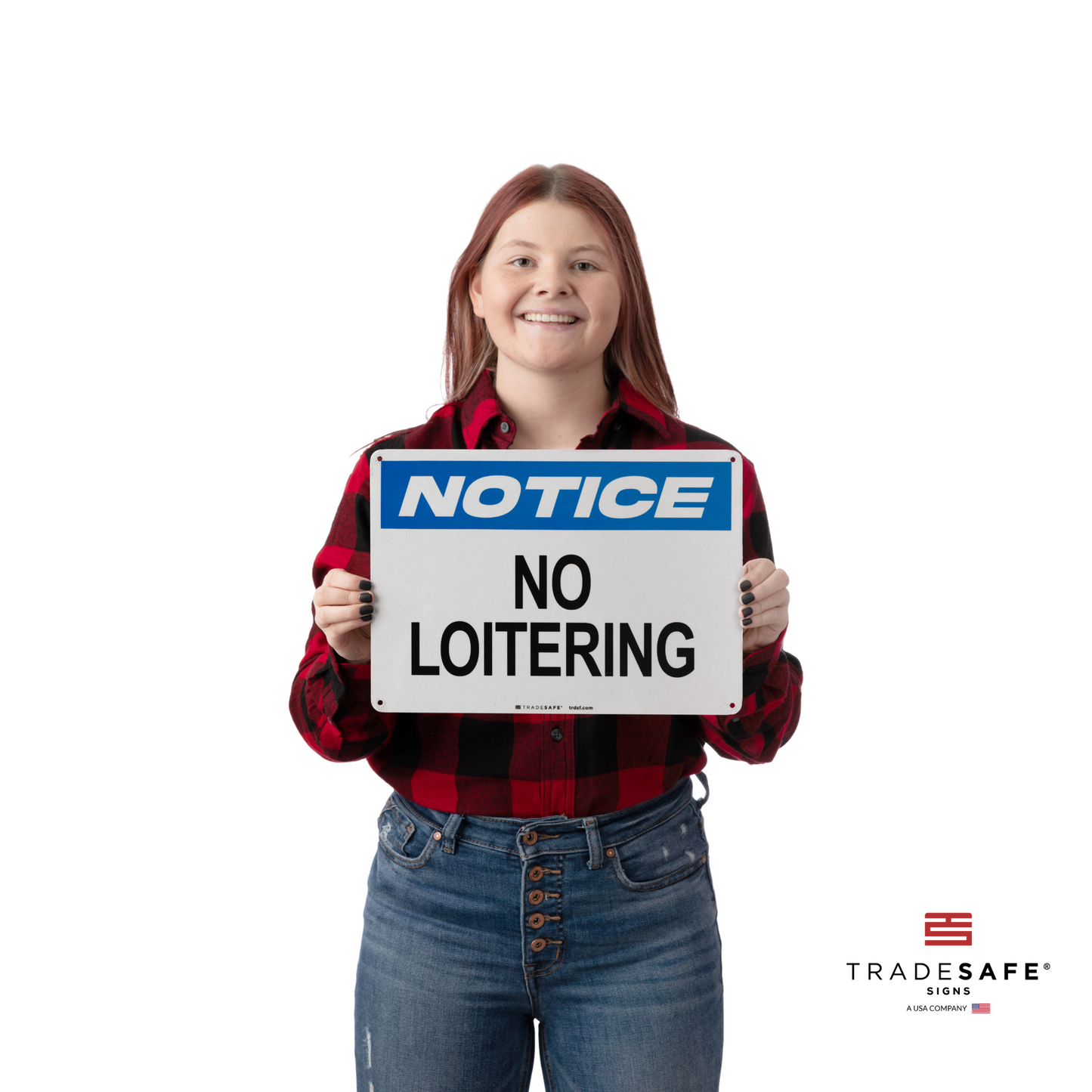 a person holding a notice sign with the text "no loitering"