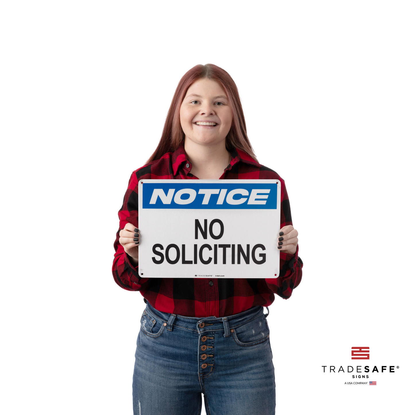 a person holding a notice sign with the text "no soliciting"