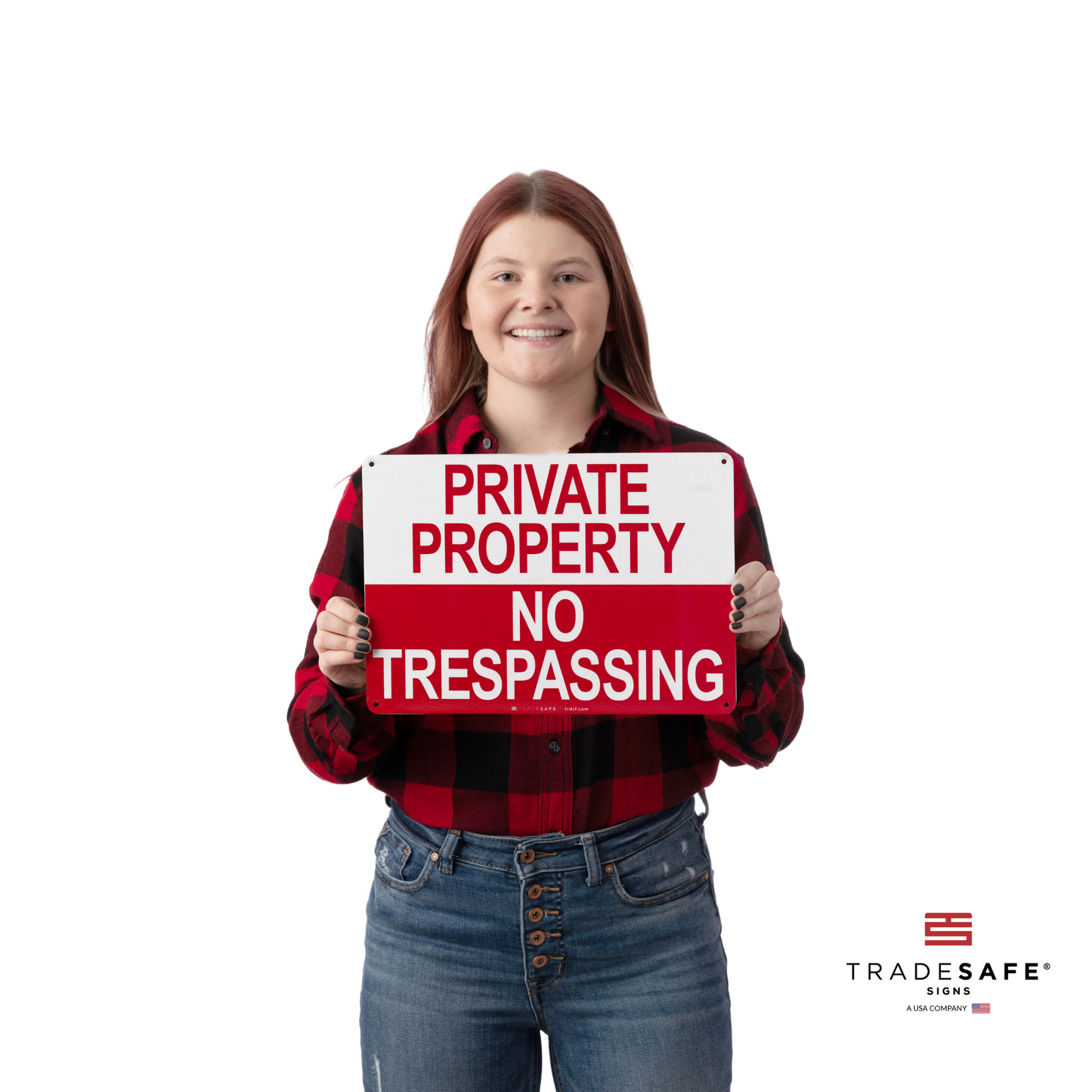 a person holding "private property no trespassing" sign