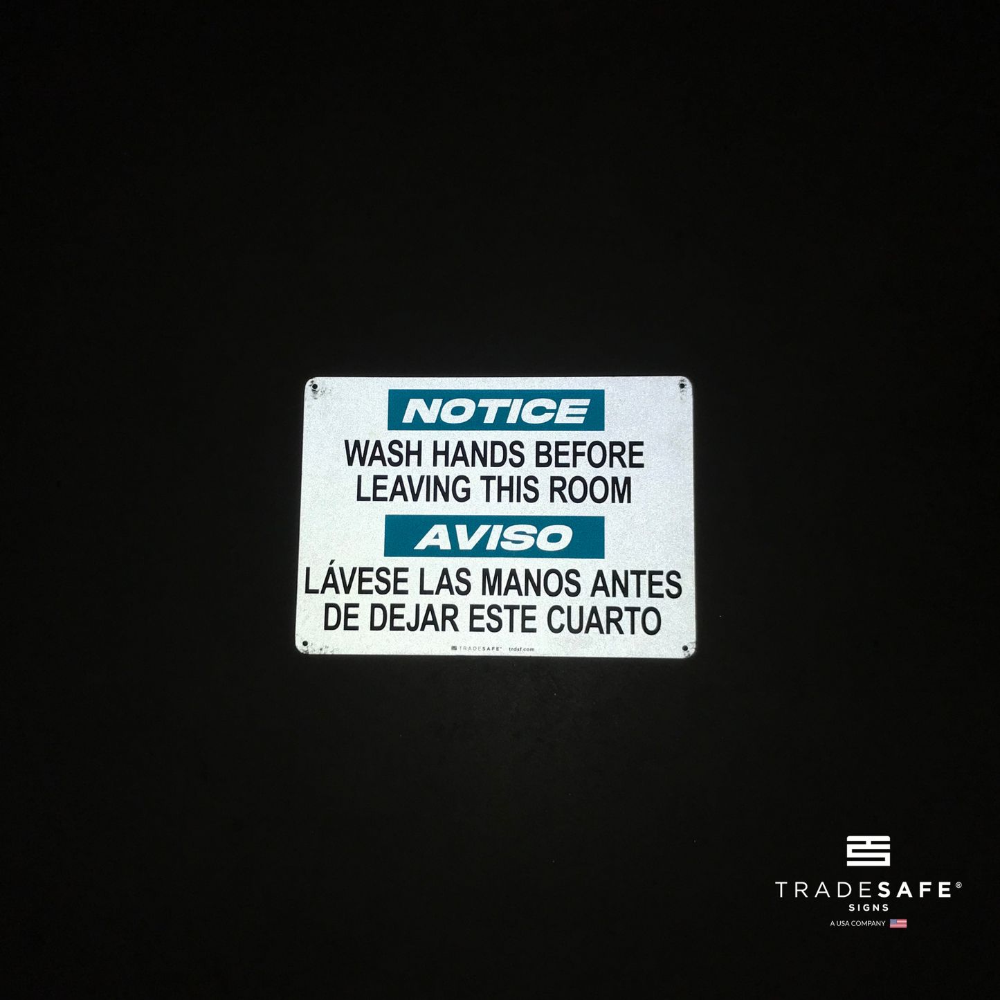 reflective attribute of restroom sign on black background