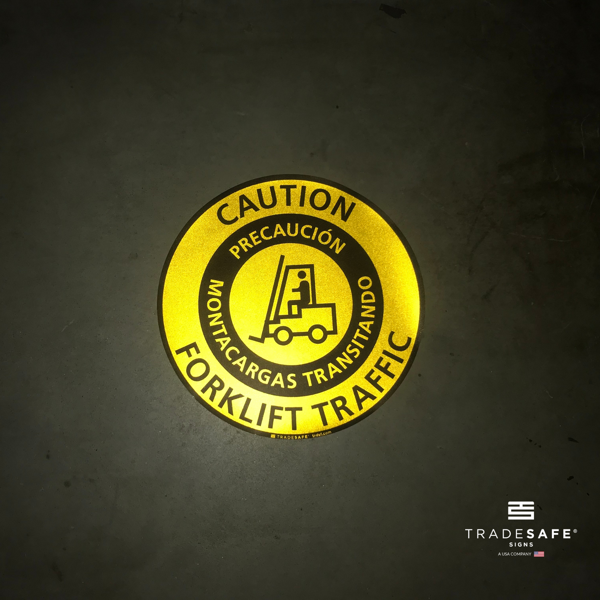 reflective attribute of adhesive vinyl bilingual (english/spanish) caution forklift traffic sign on black background