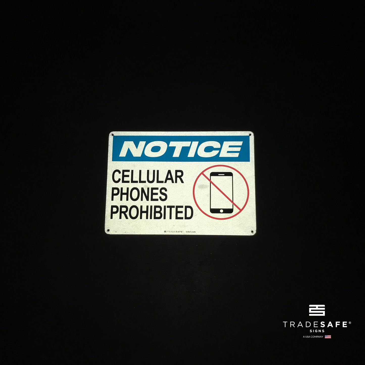 reflective attribute of cell phone prohibited sign on black background