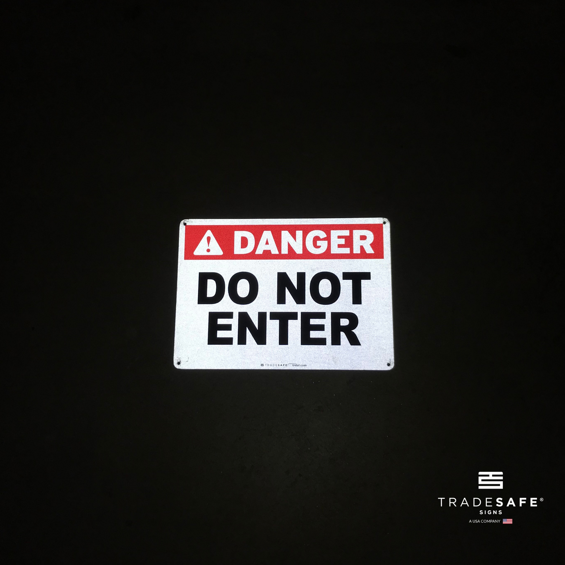 reflective attribute of danger sign on black background