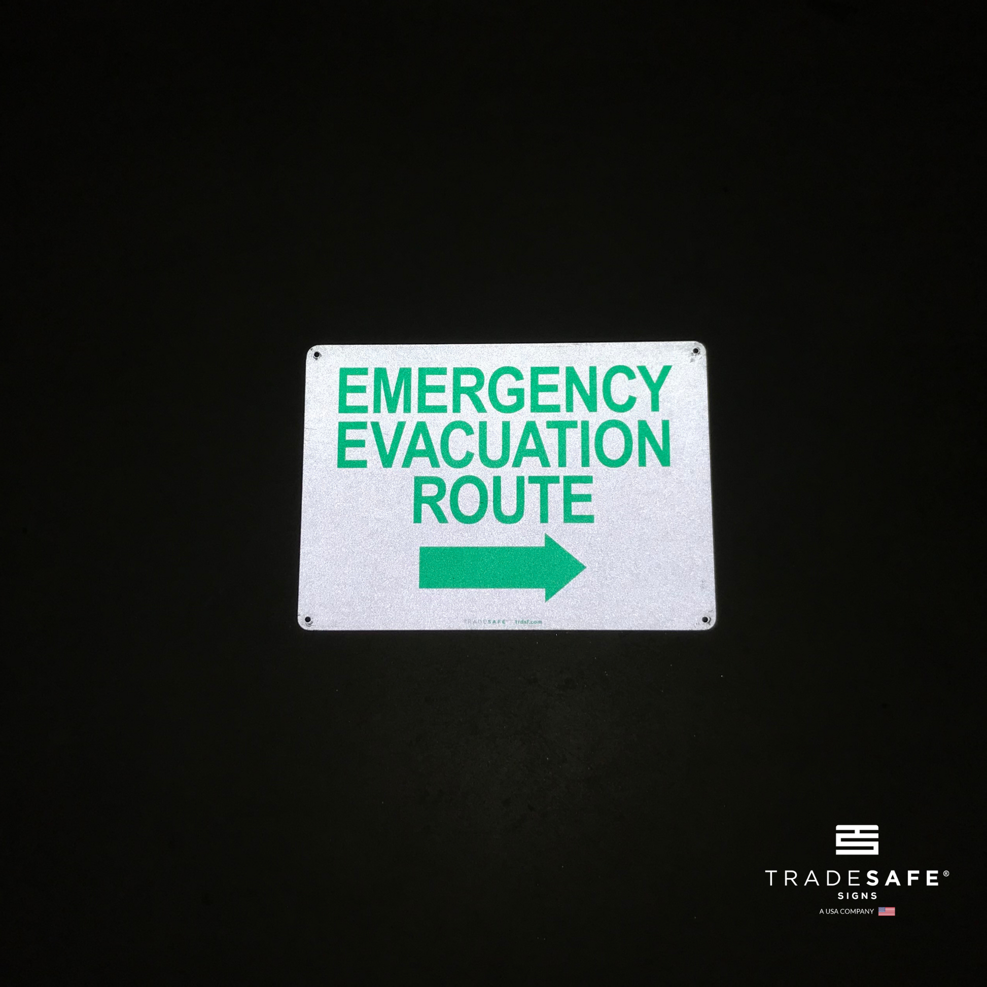 reflective attribute of evacuation sign on black background