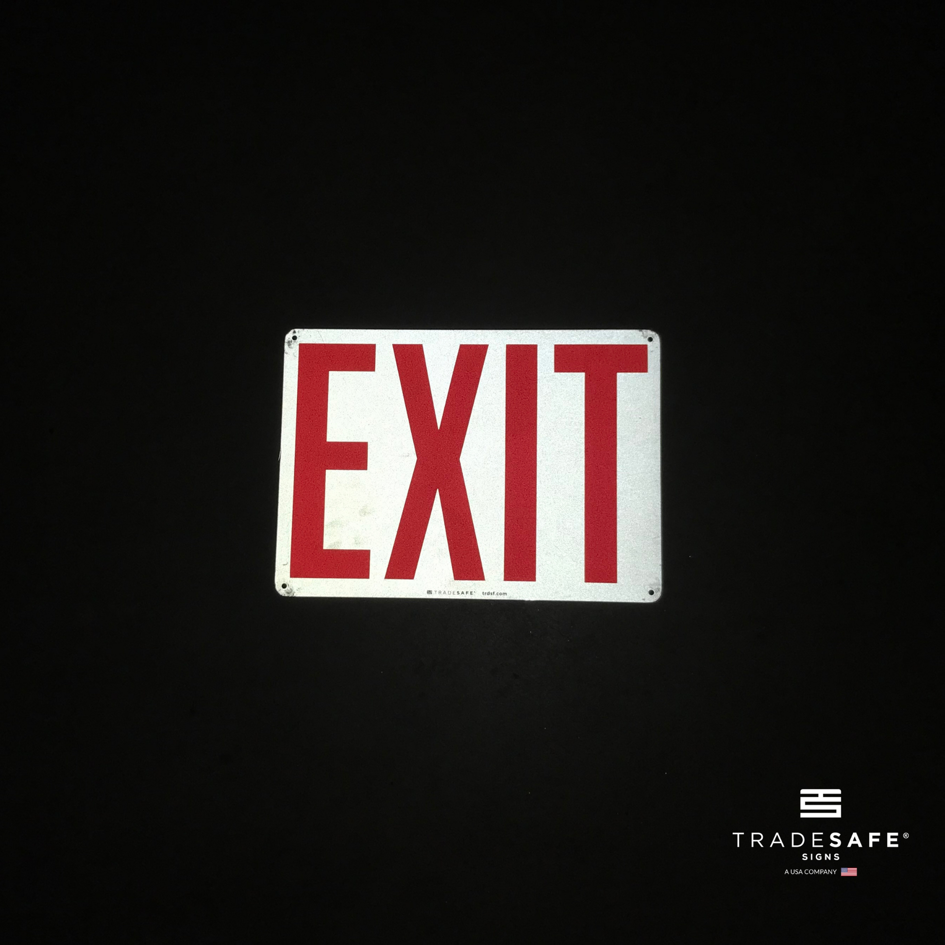 reflective attribute of exit sign on black background