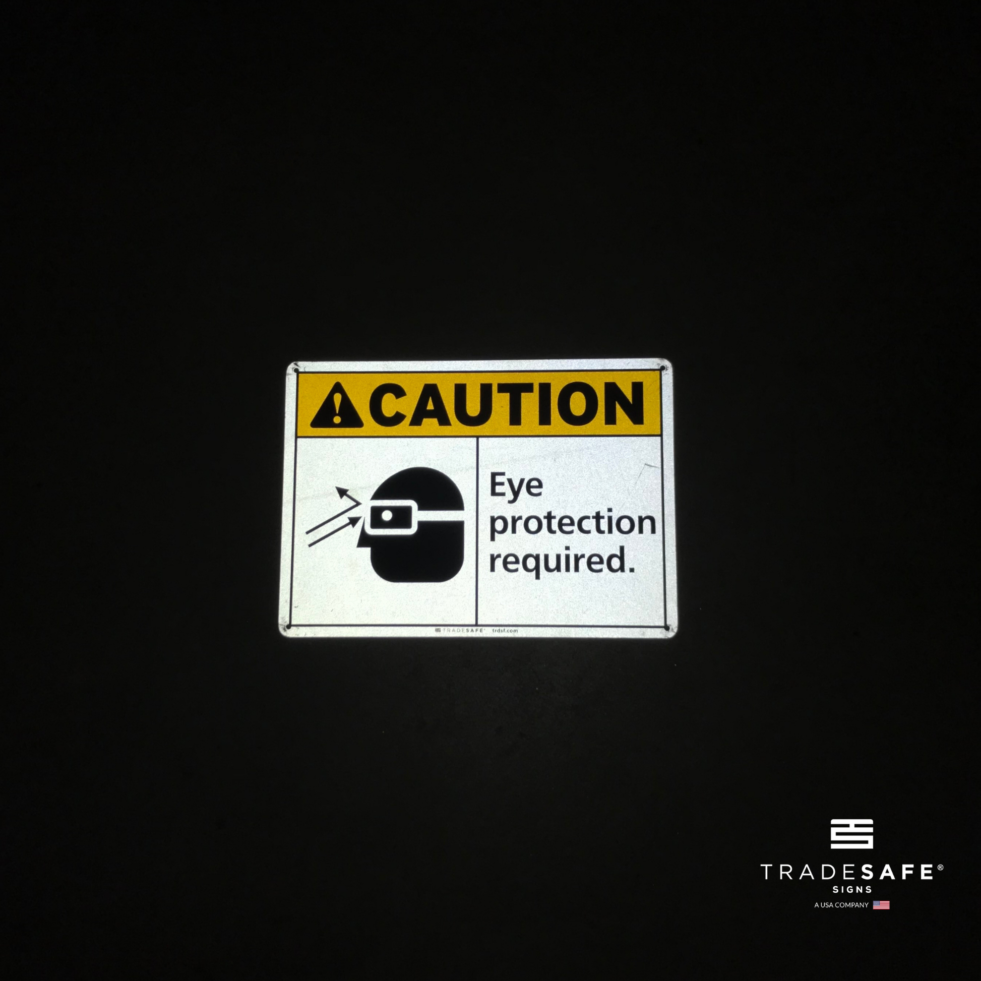 reflective attribute of caution sign on black background