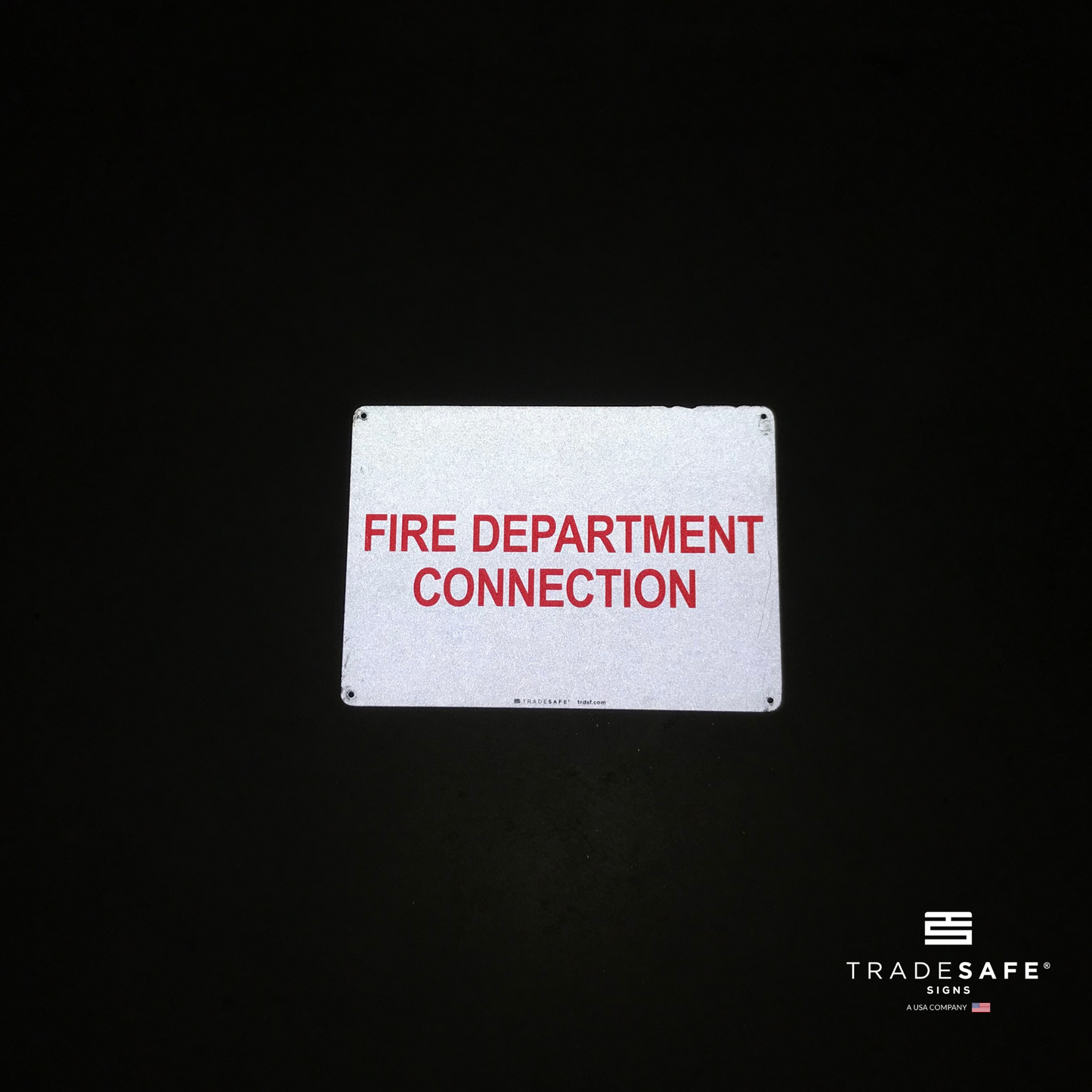 reflective attribute of fire safety sign on black background