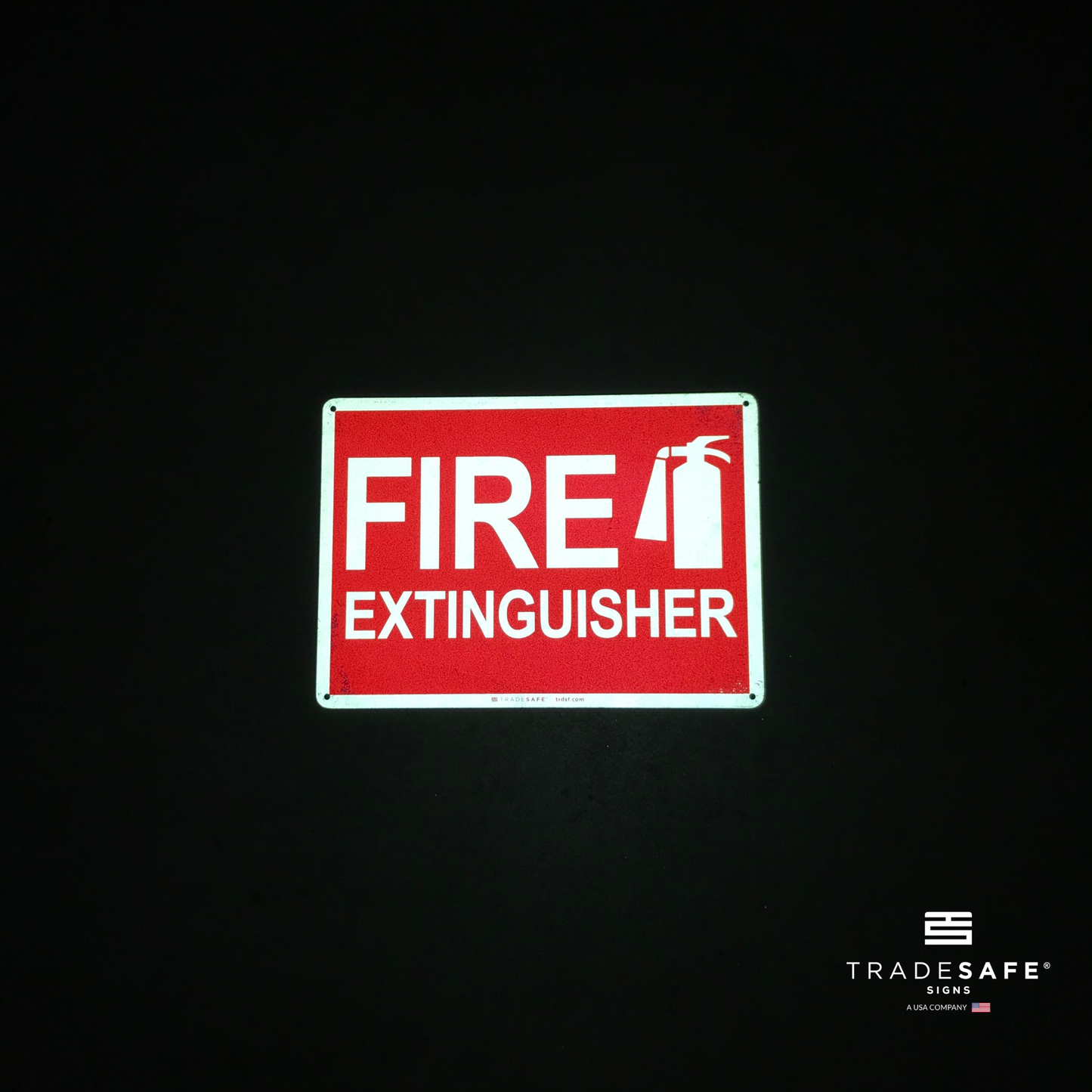reflective attribute of fire extinguisher sign on black background