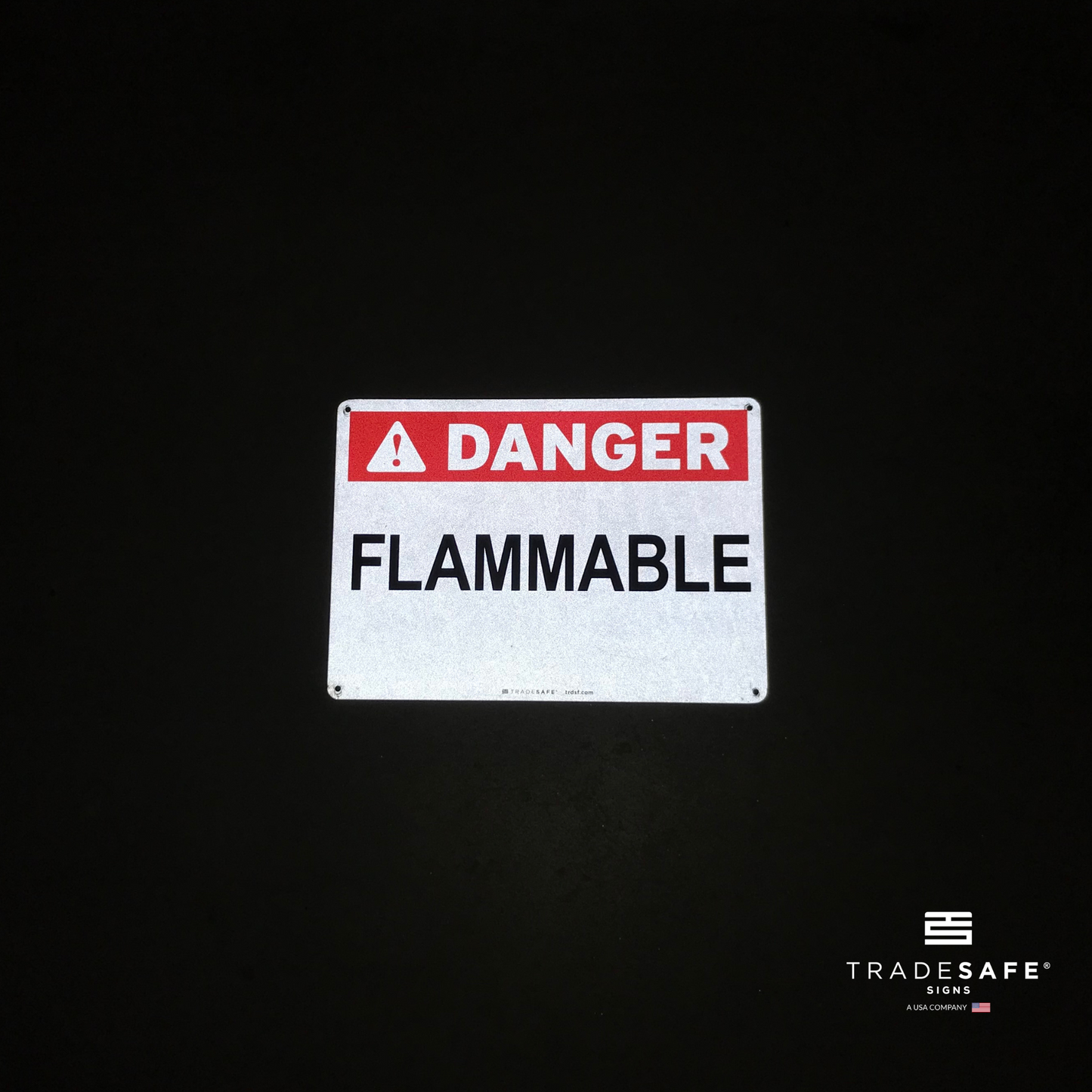 reflective attribute of flammable sign on black background