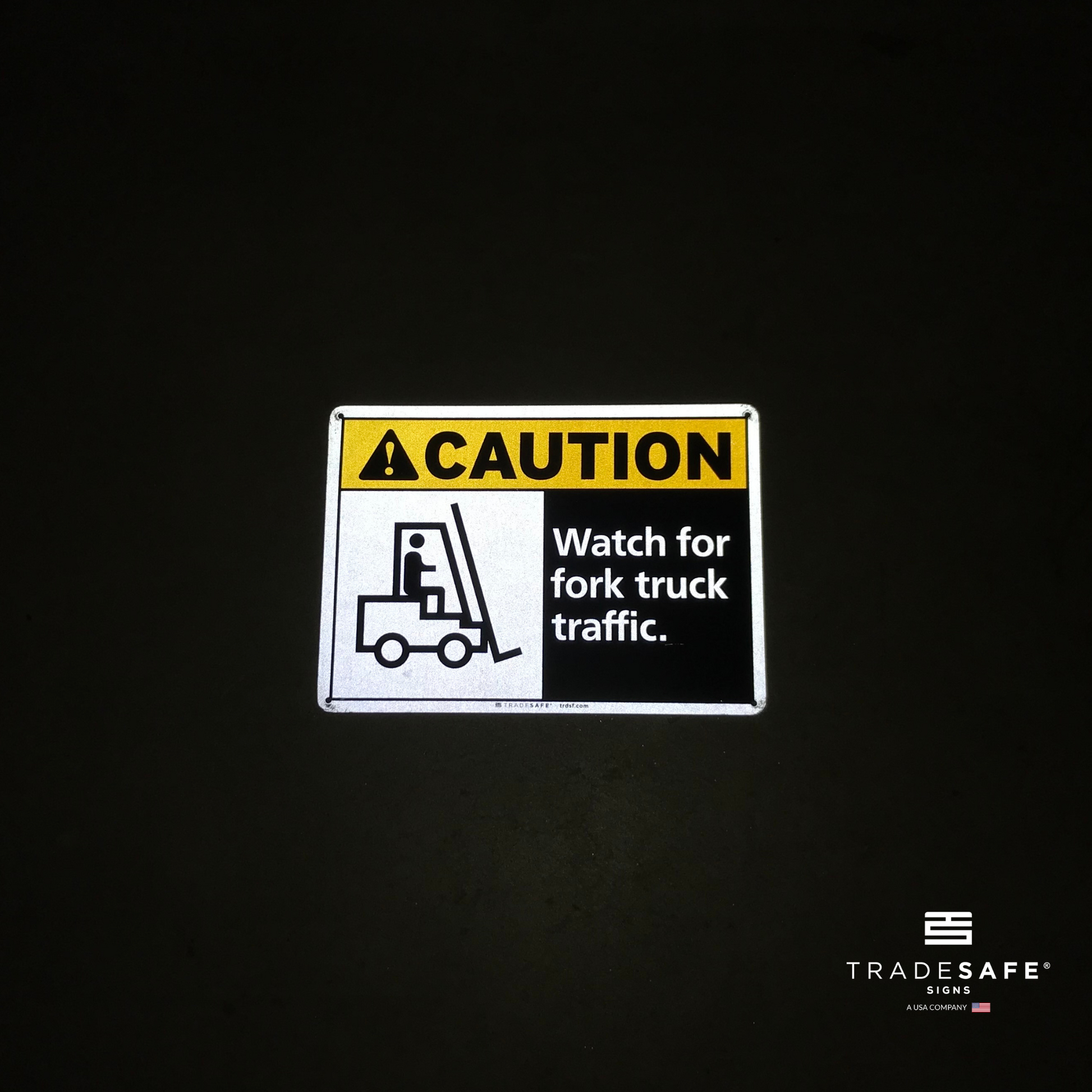 reflective attribute of forklift traffic sign on black background