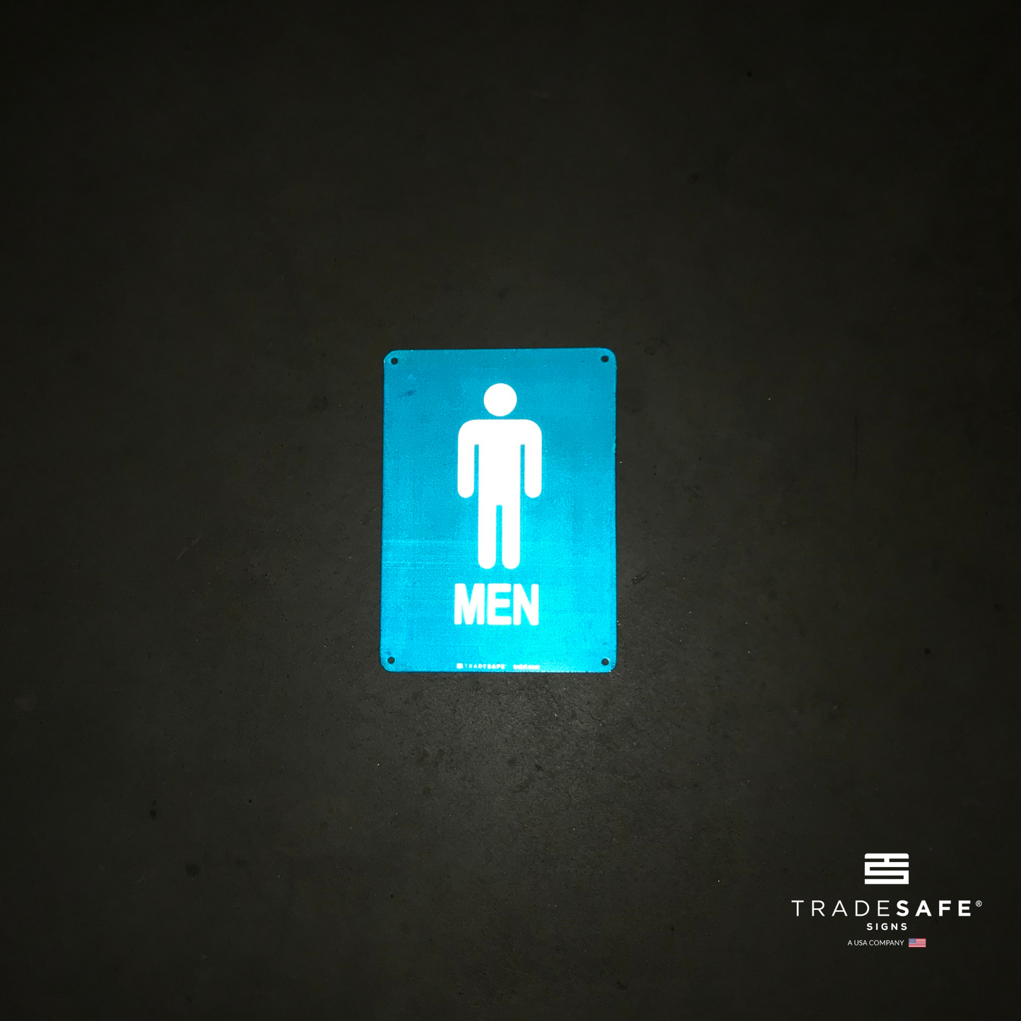 reflective attribute of men's restroom sign on black background