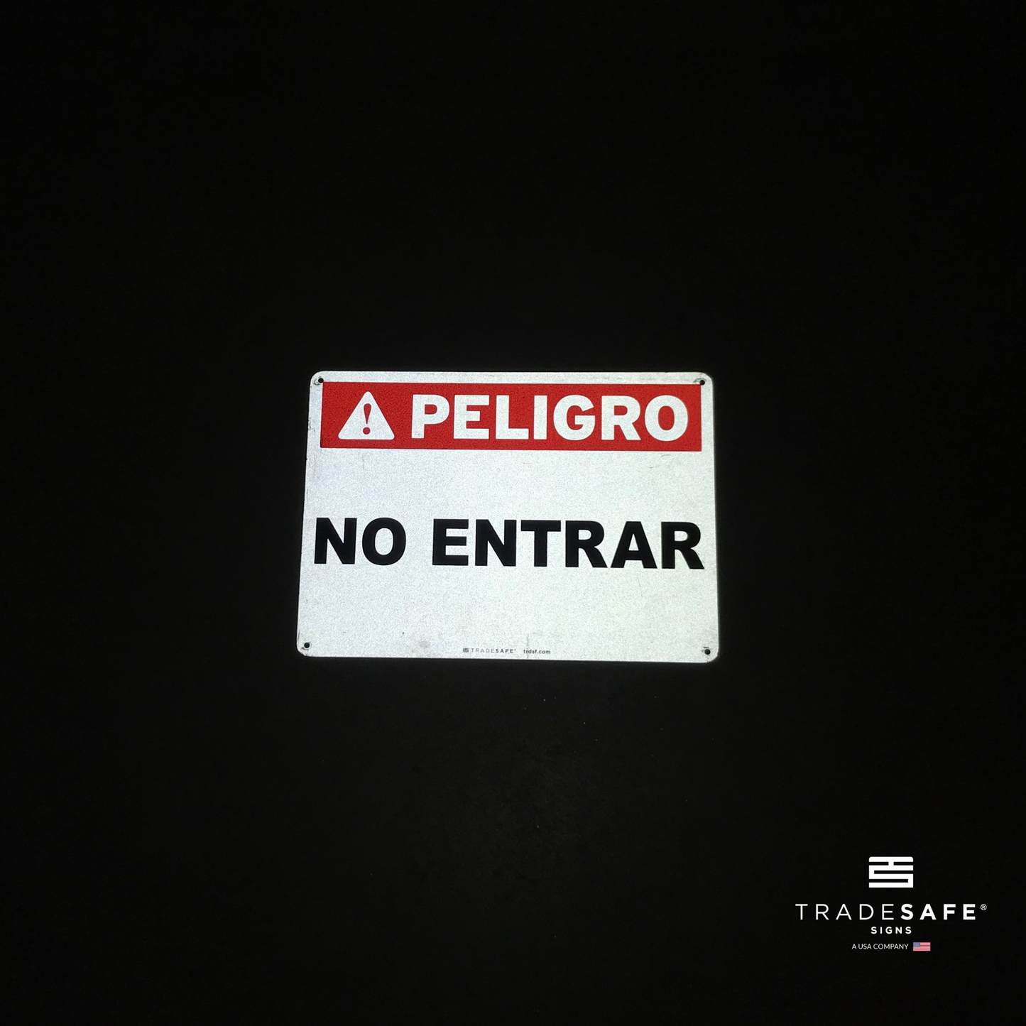 reflective attribute of peligro sign on black background