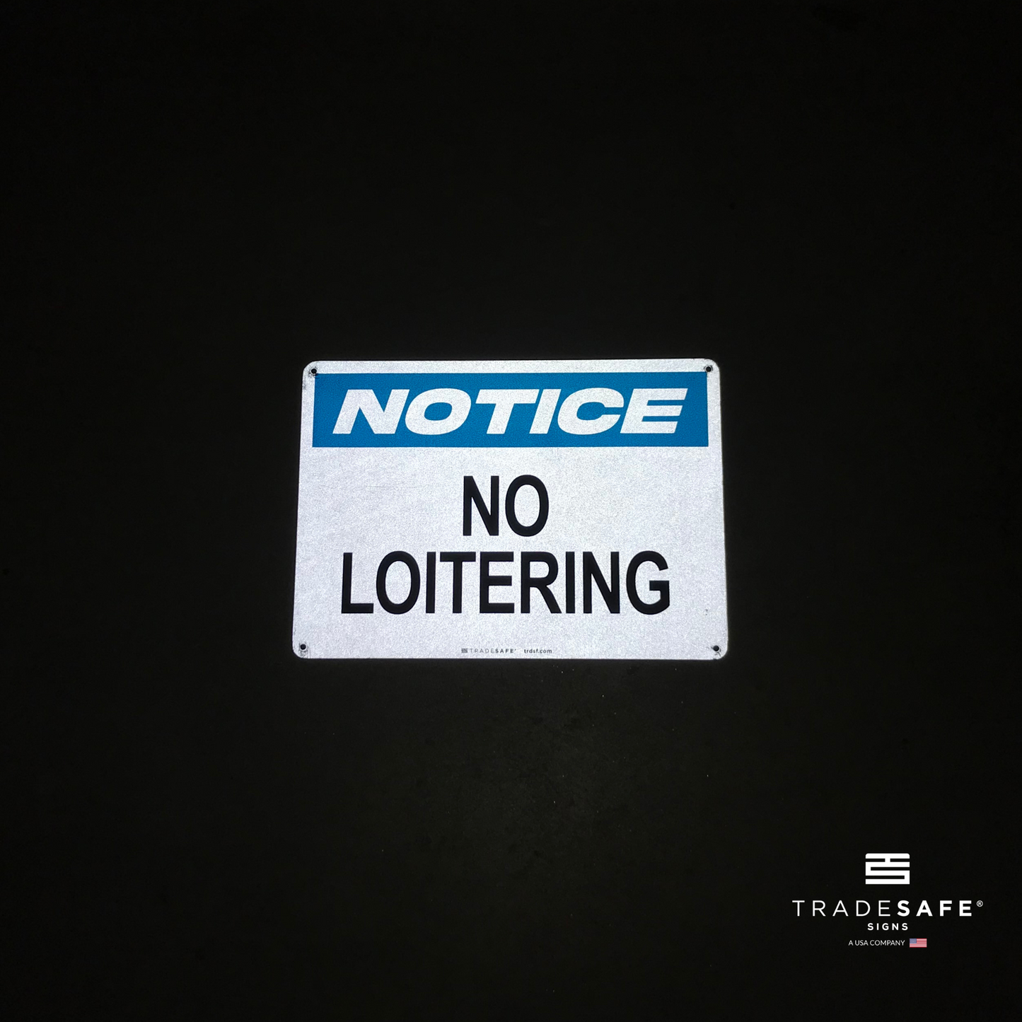 reflective attribute of no loitering sign on black background