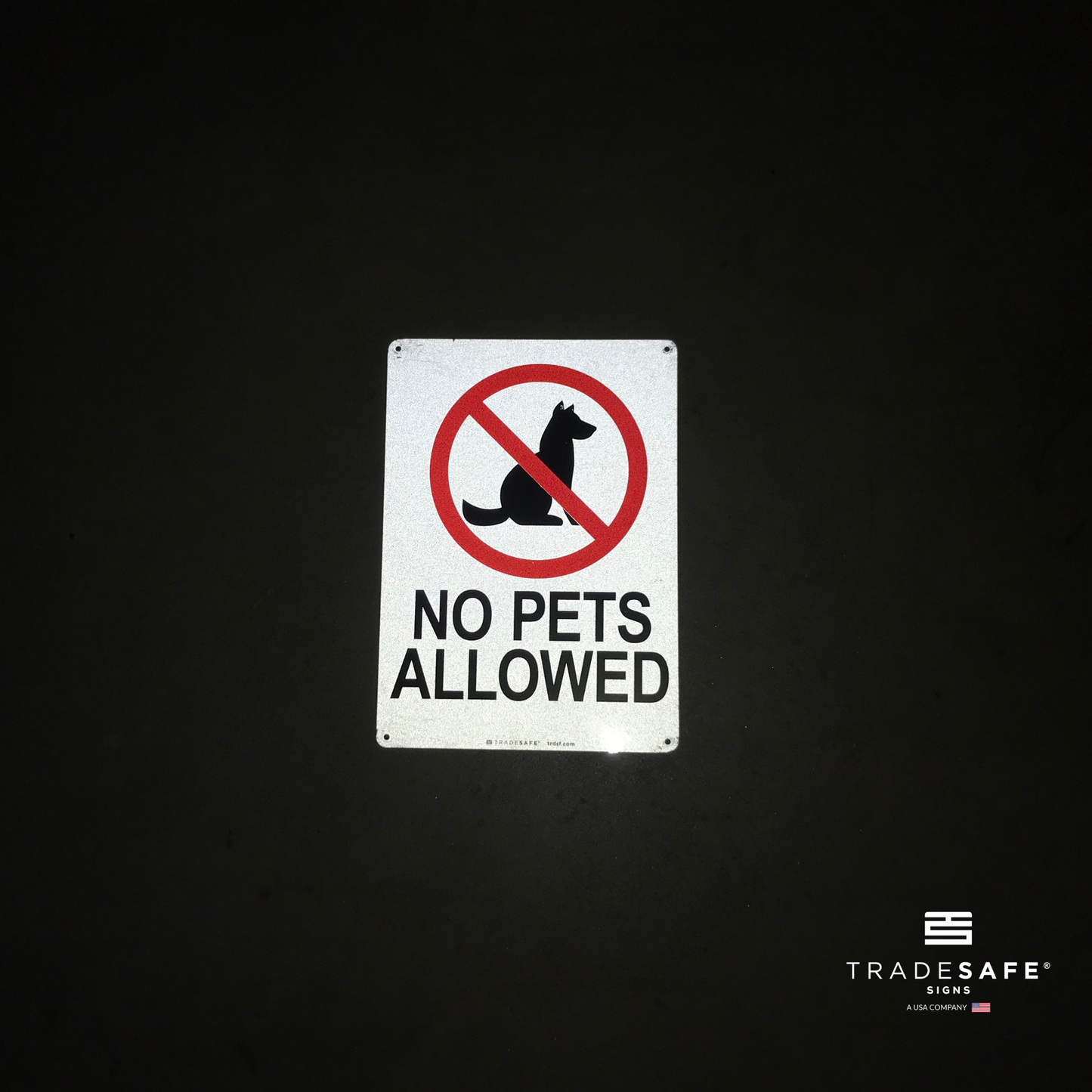 reflective attribute of no pets allowed sign on black background