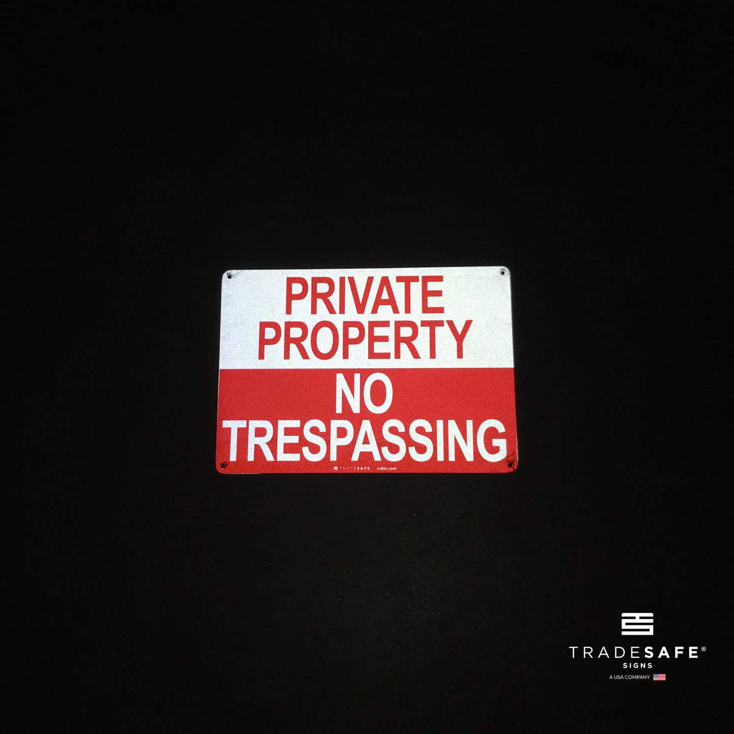 reflective attribute of private property sign on black background