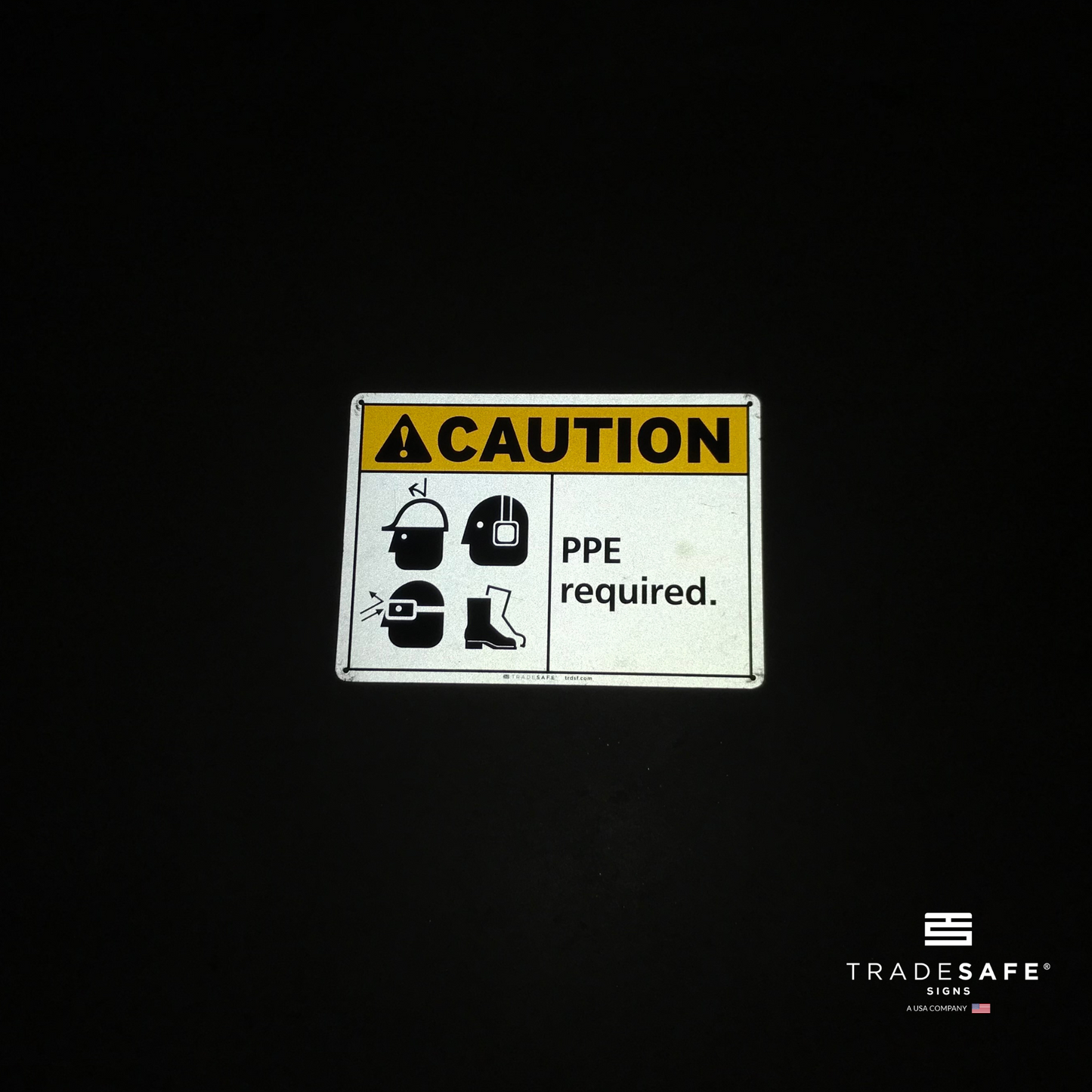 reflective attribute of caution sign on black background