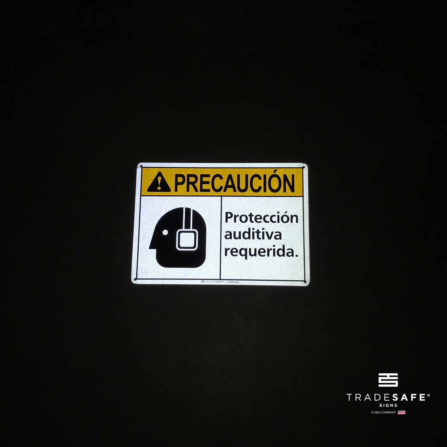 reflective attribute of hearing protection required sign in spanish