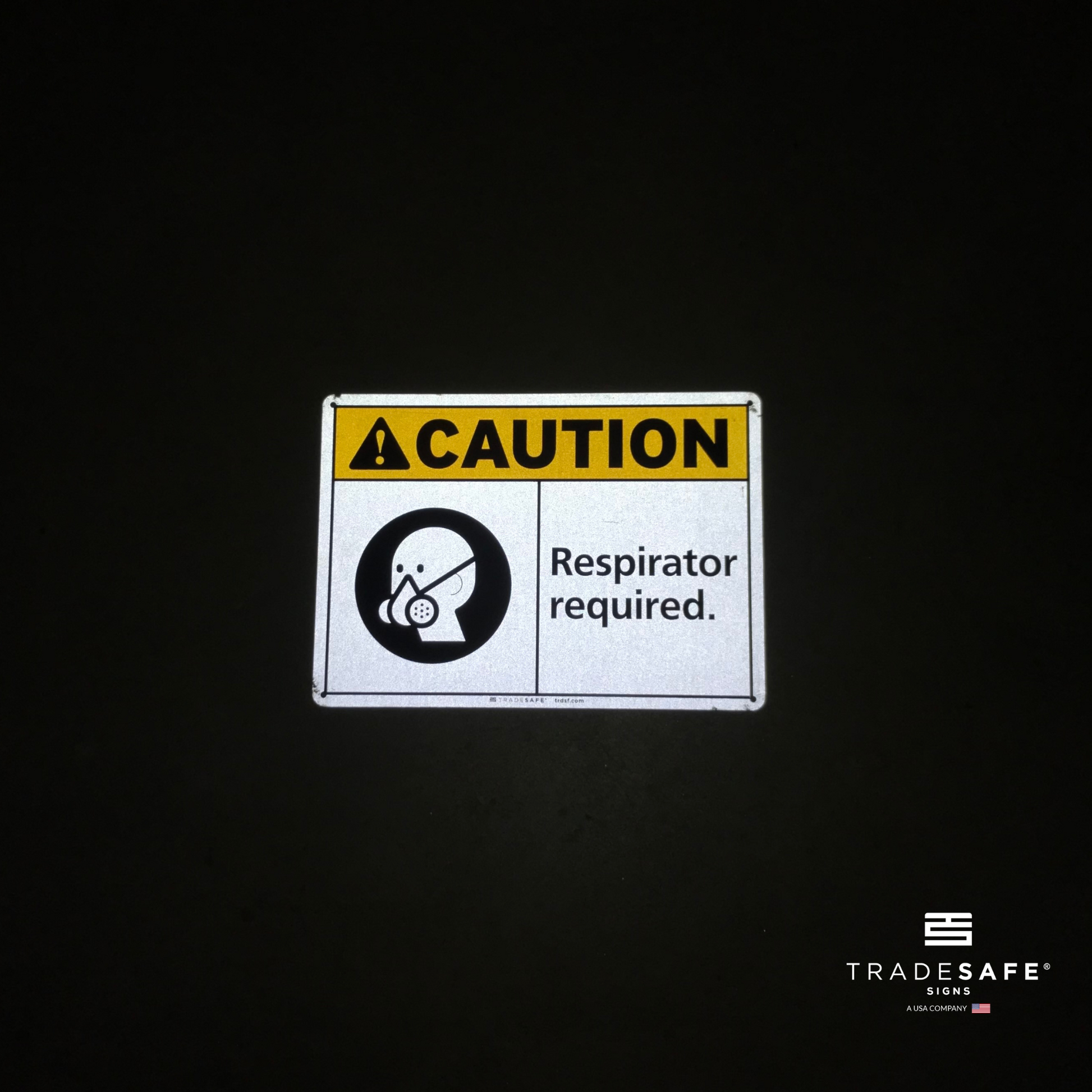 reflective attribute of caution sign on black background