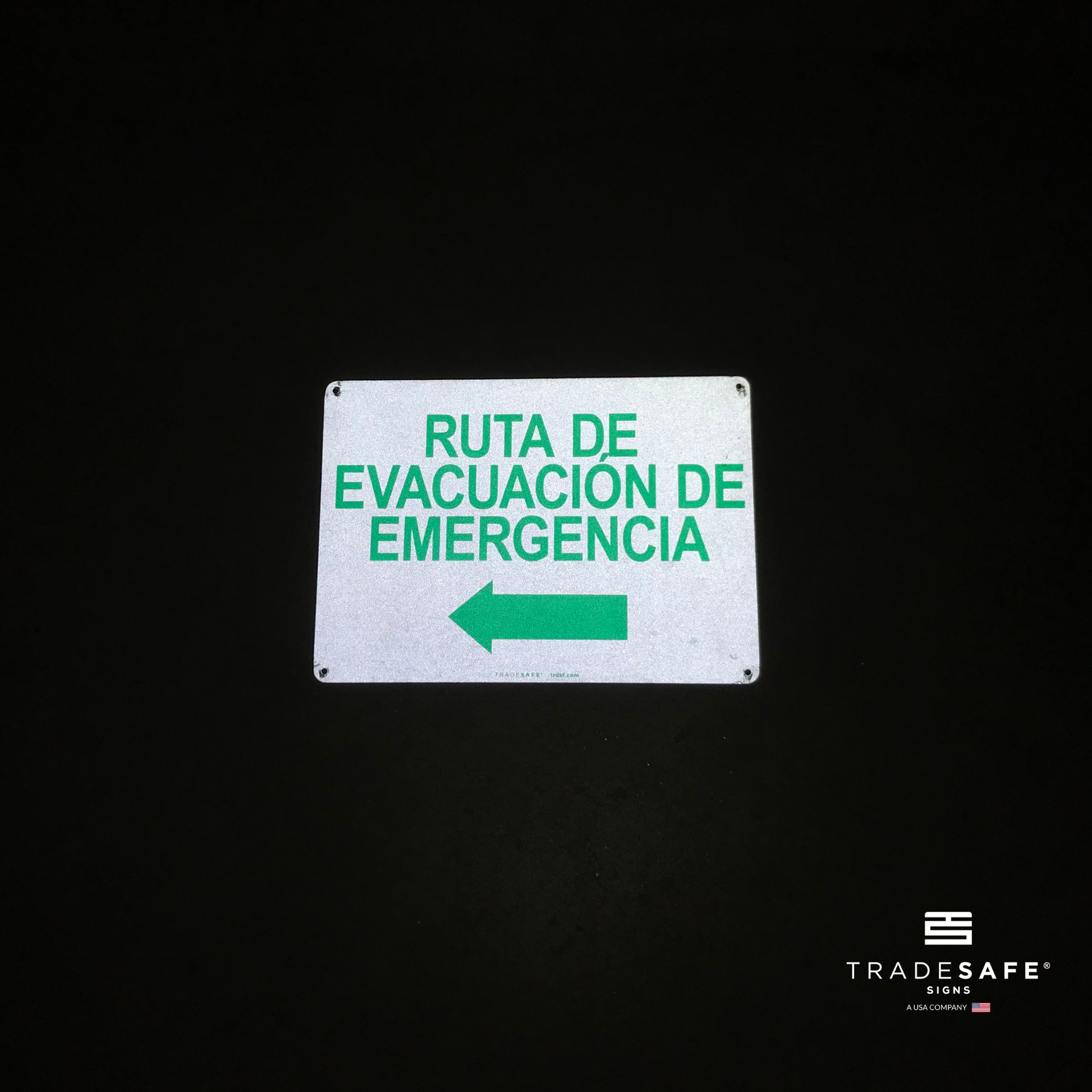 reflective attribute of evacuation sign on black background