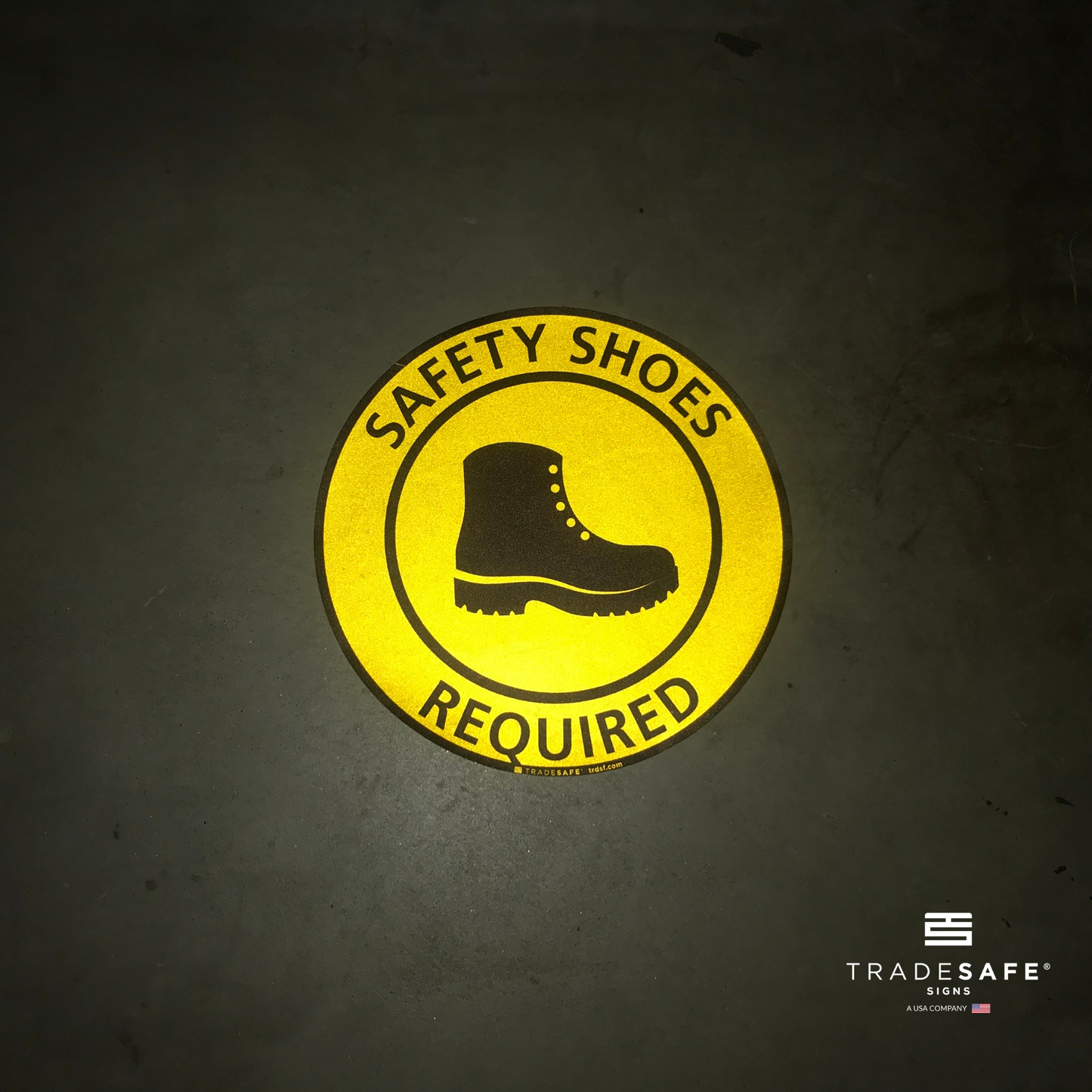 reflective attribute of adhesive vinyl safety shoes required sign on black background
