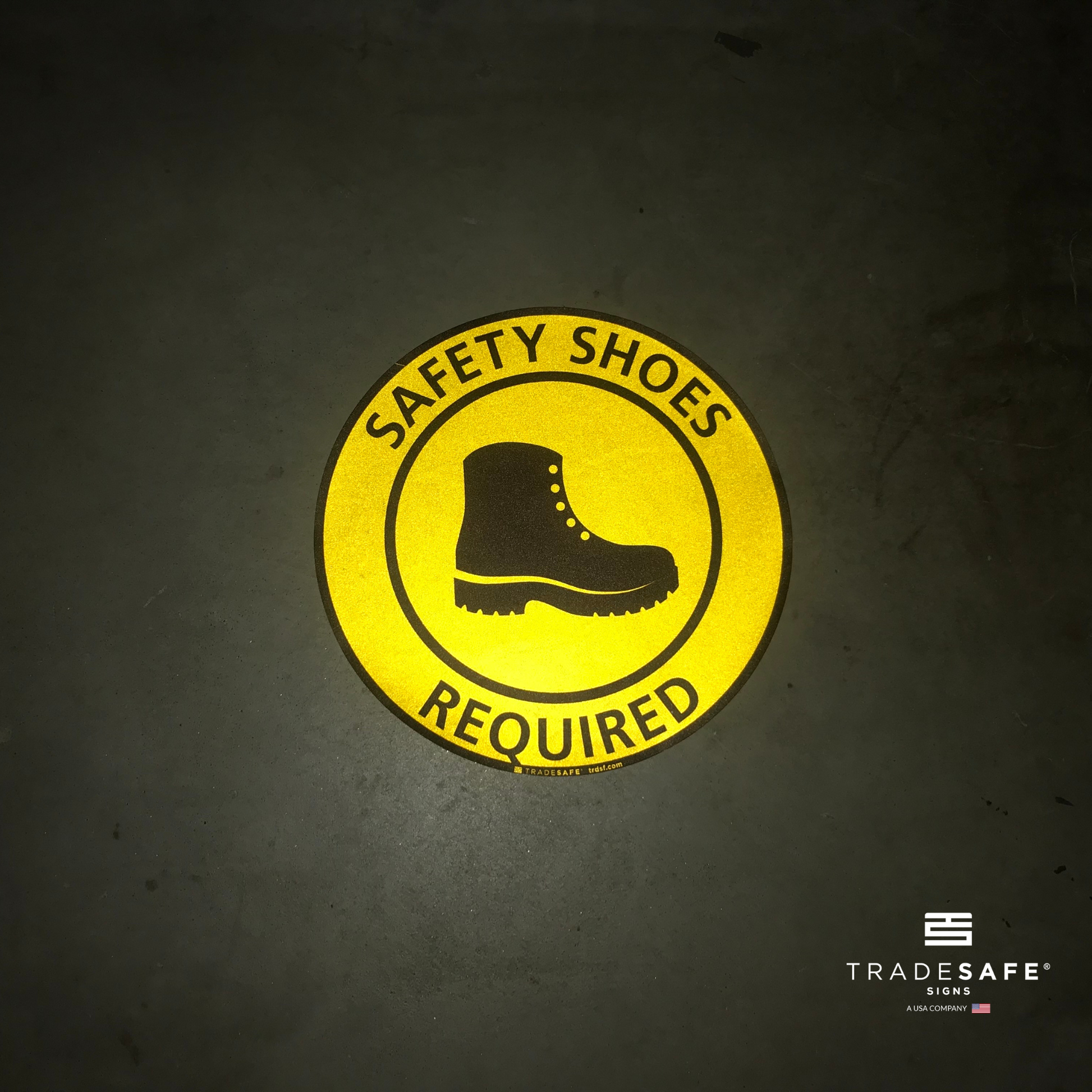 reflective attribute of adhesive vinyl safety shoes required sign on black background