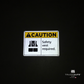reflective attribute of caution sign on black background