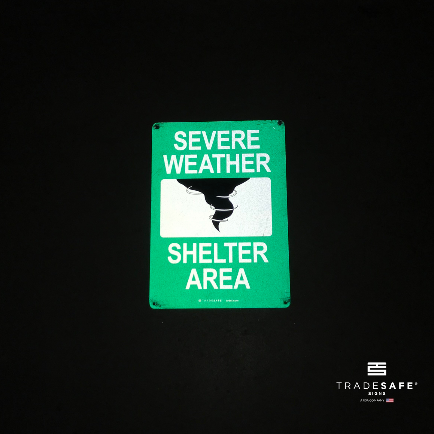 reflective attribute of evacuation sign on black background