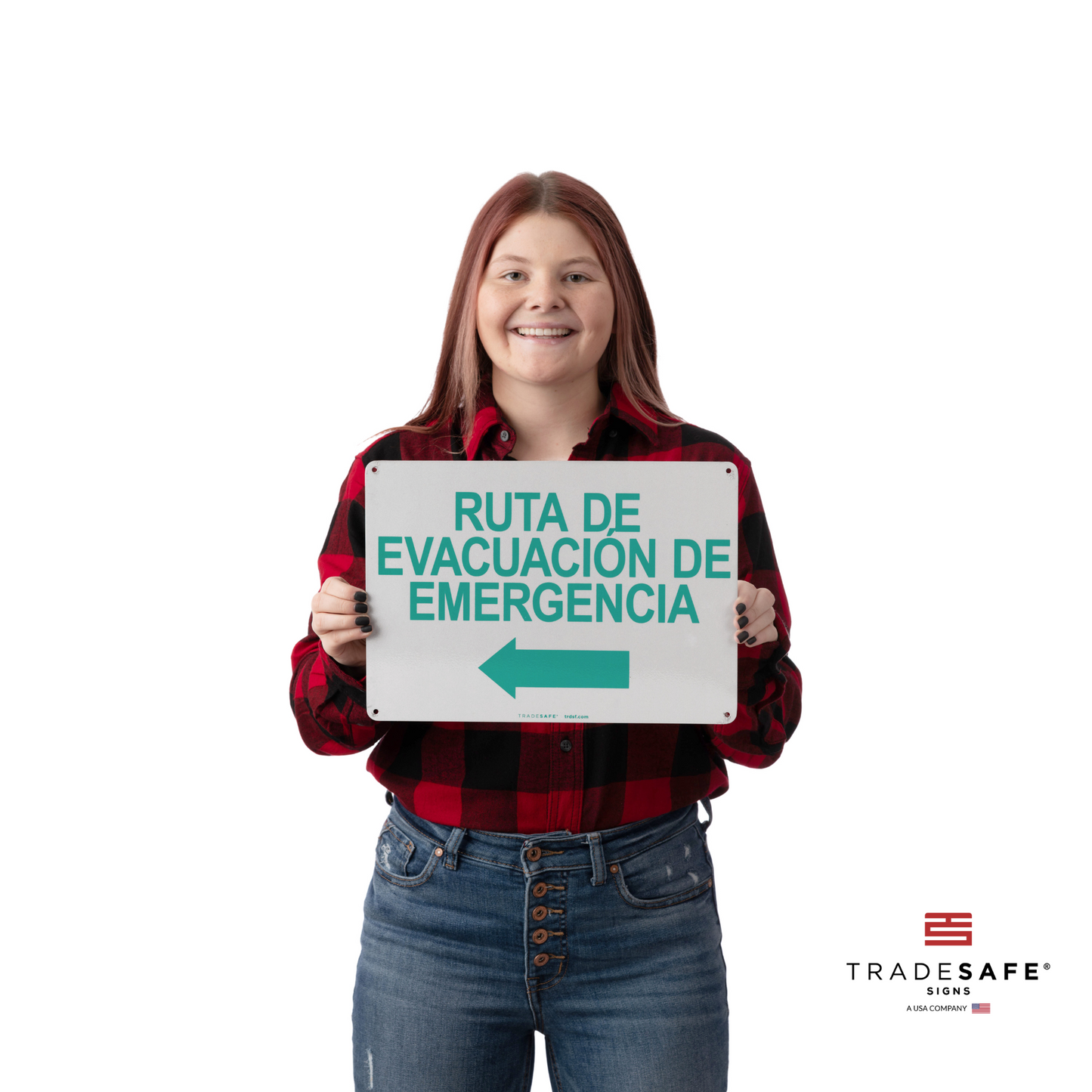 a person holding emergency evacuation route sign in spanish