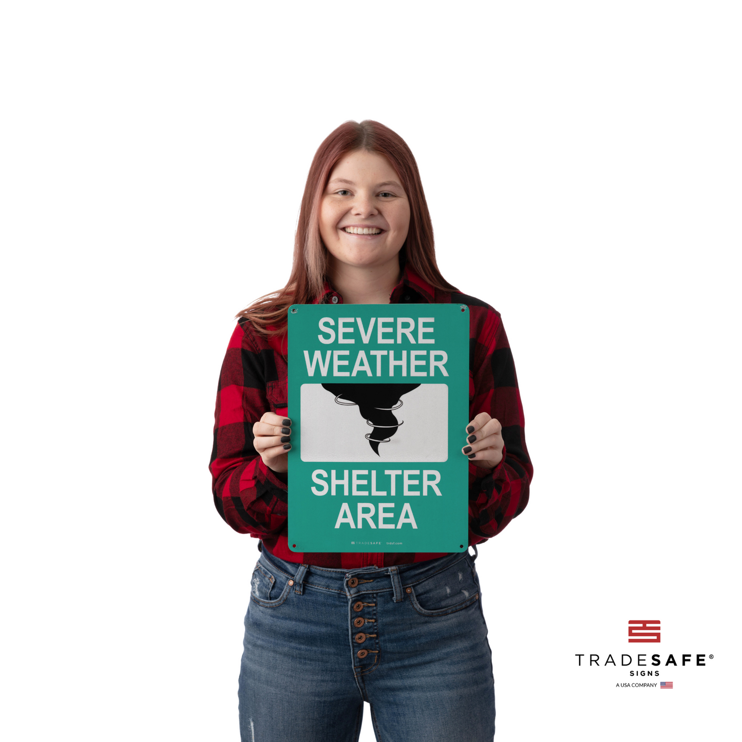 a person holding severe weather shelter area sign