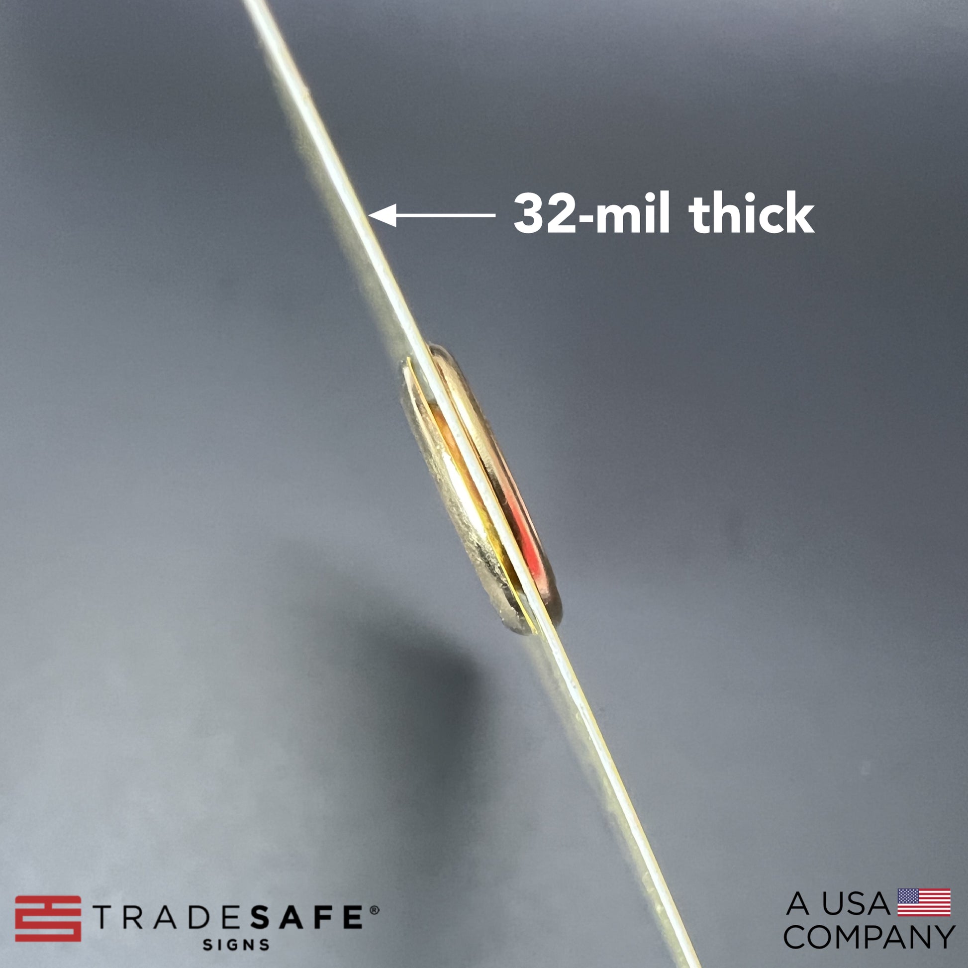 macro shot of caution out of service tag showing its thickness; 32-mil thick