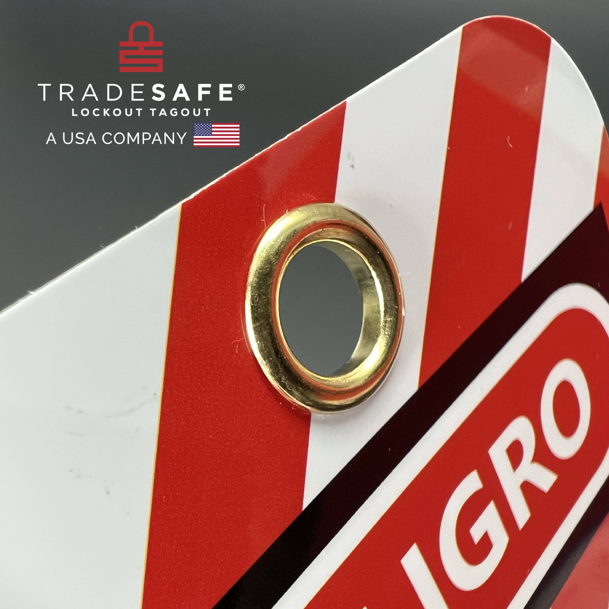 close-up view of peligro danger tag focusing on its hole