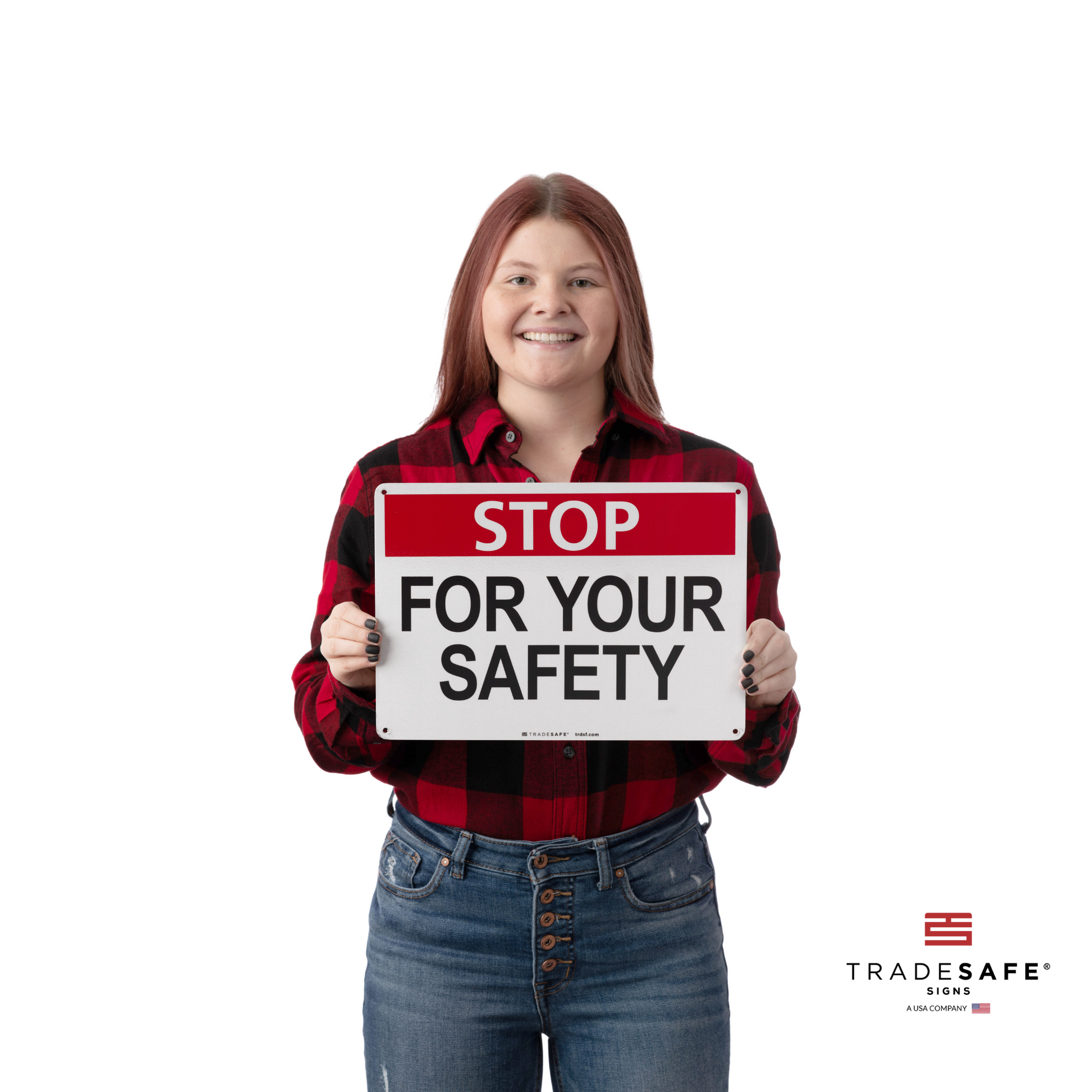 a person holding the stop sign