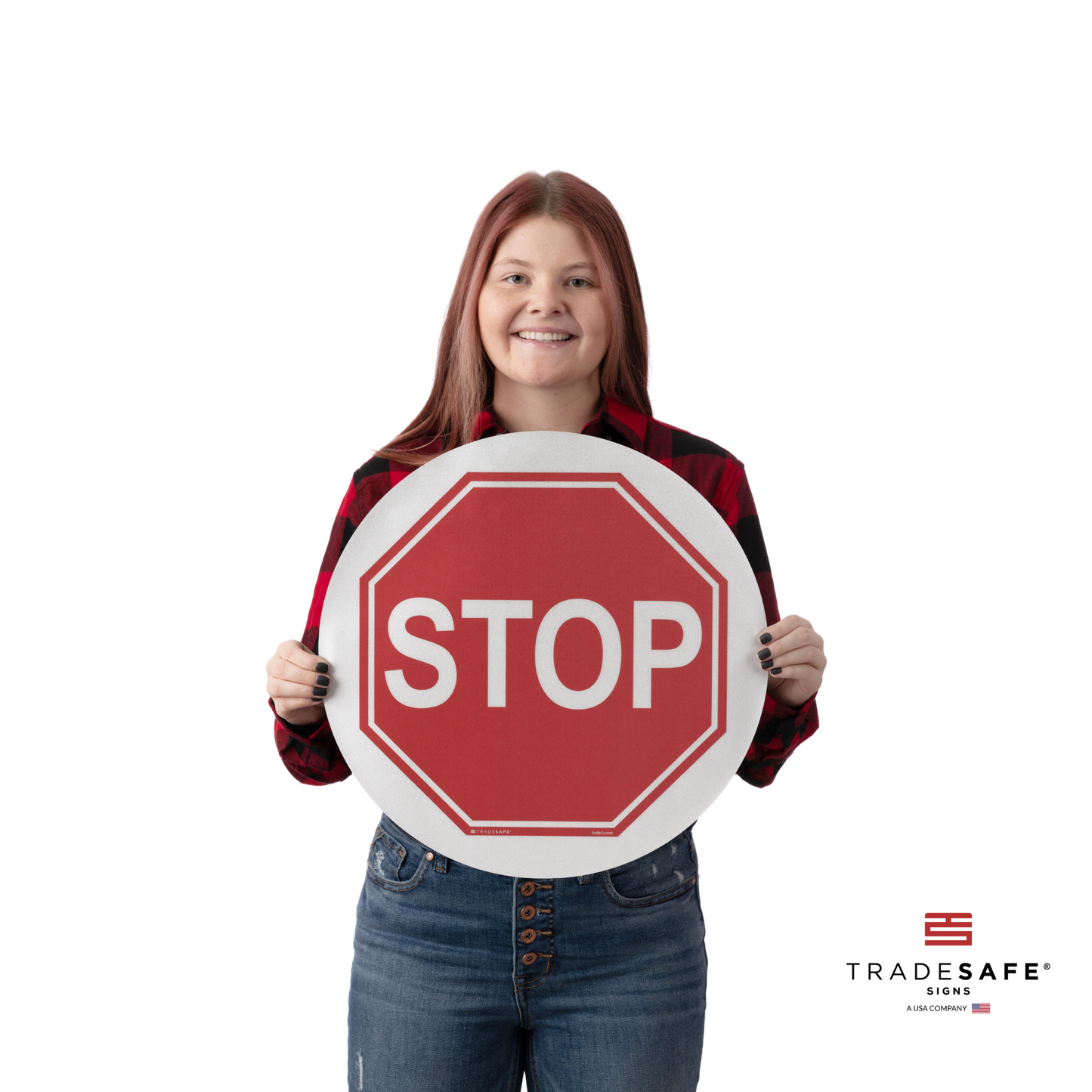 a person holding the stop sign