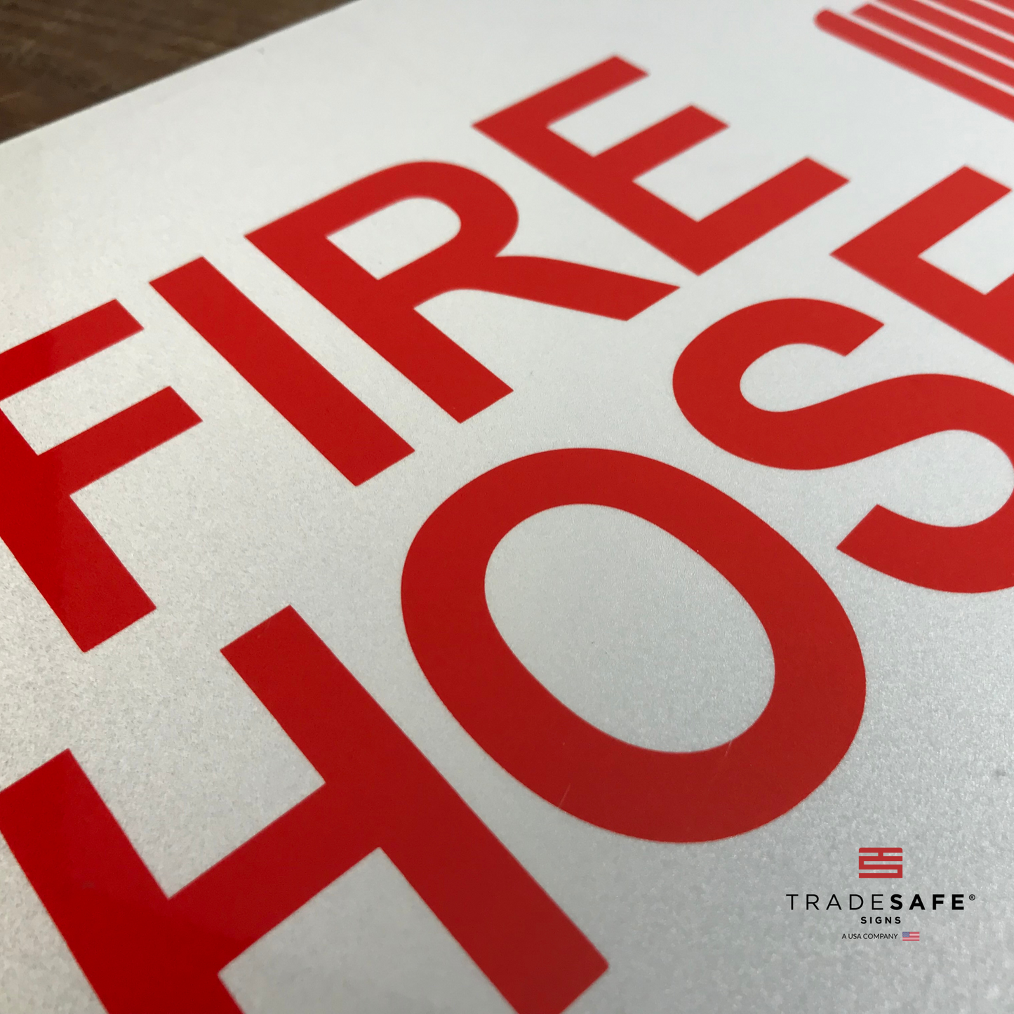 vibrant and highly visible fire hose sign