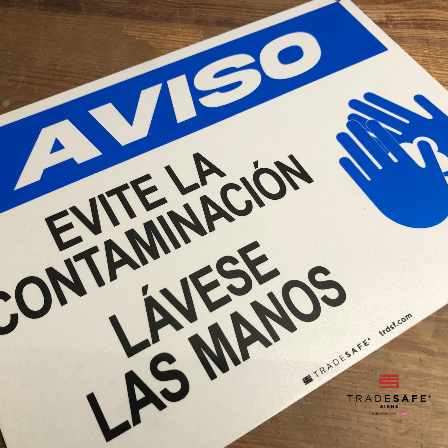 vibrant and highly visible wash your hands sign in spanish