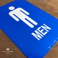 vibrant and highly visible men's restroom sign