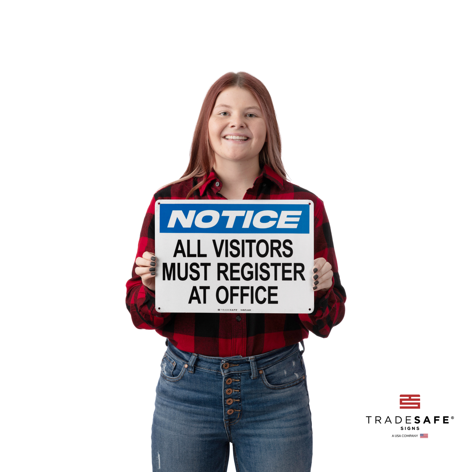 a person holding a notice sign with the text "all visitors must register at office"