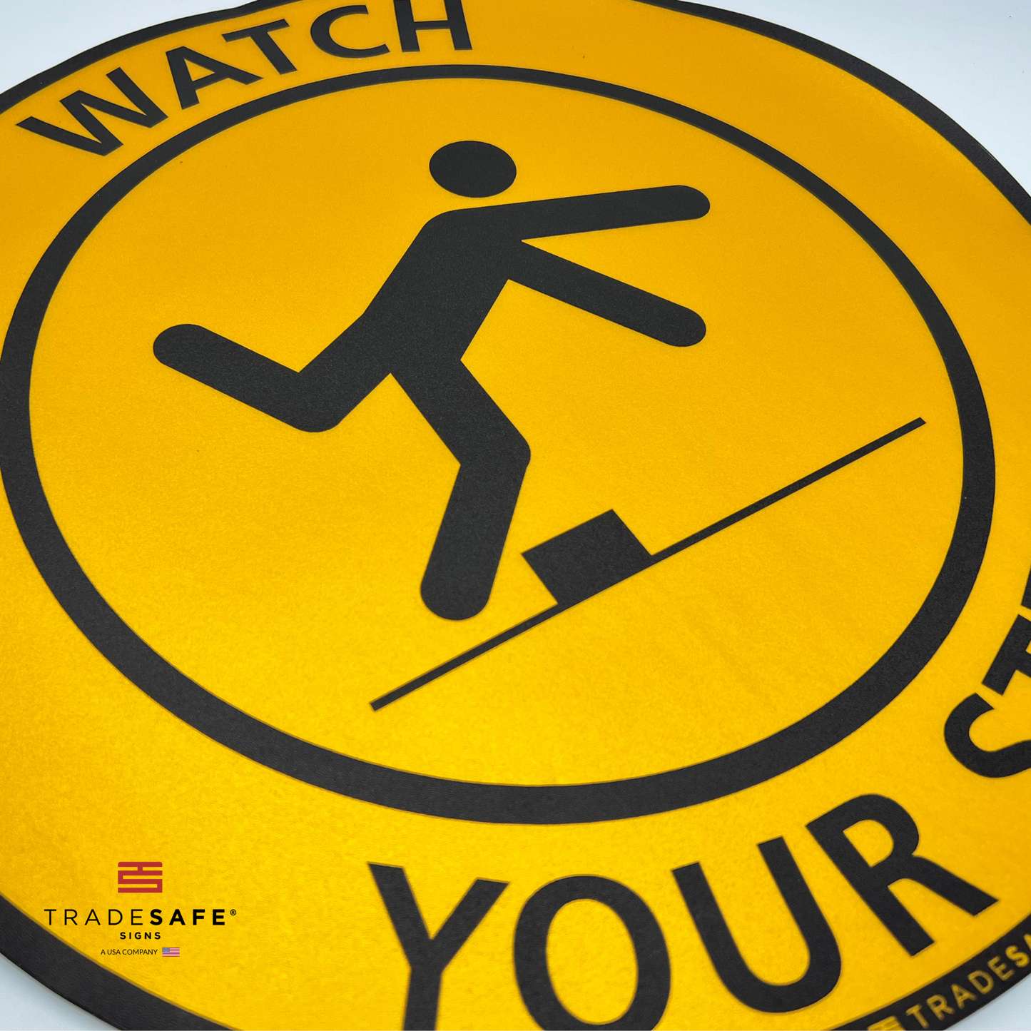 close-up of "watch your step" sign